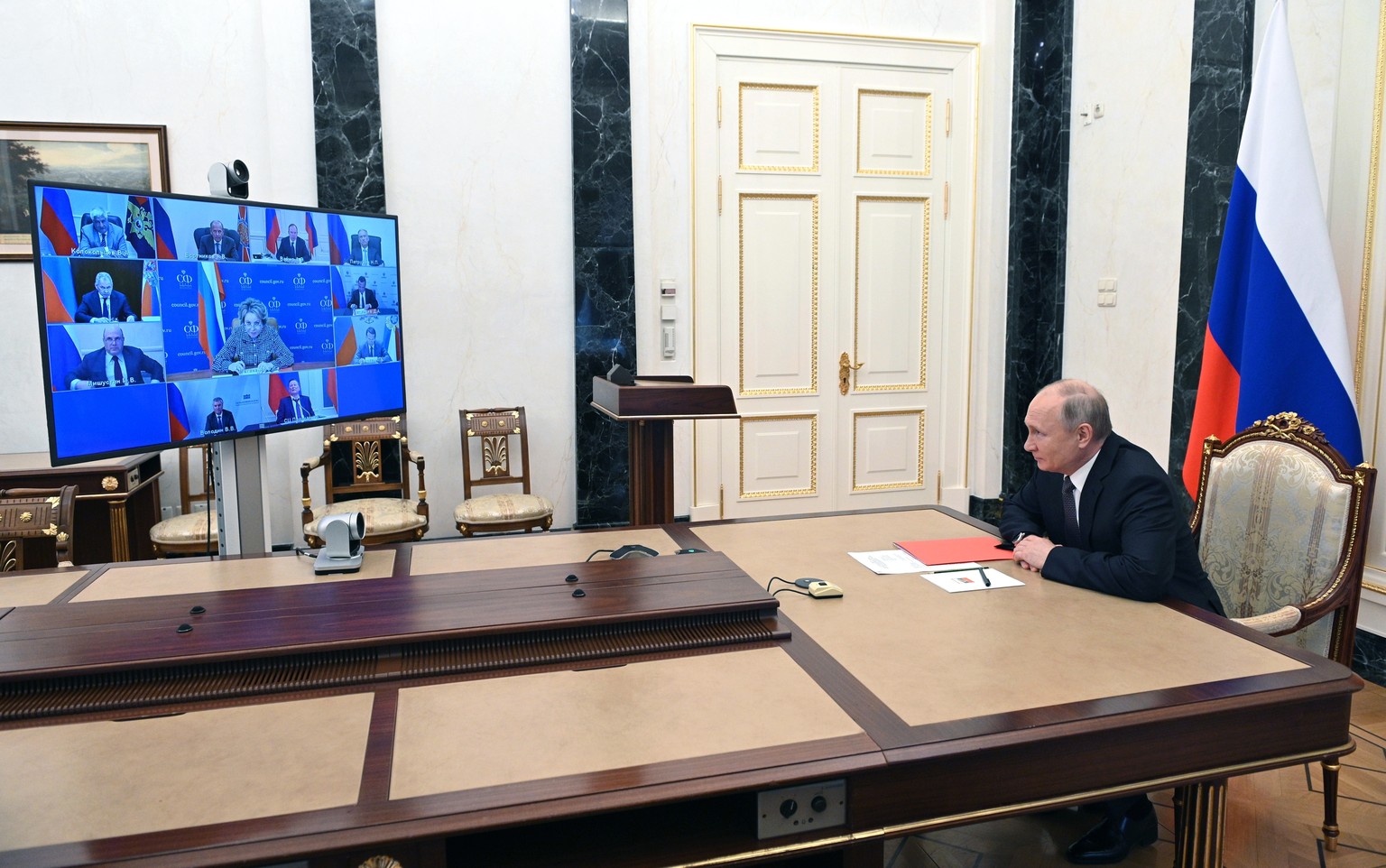 Russian President Vladimir Putin chairs a Security Council meeting via video conference at the Novo-Ogaryovo residence outside Moscow, Russia, Friday, June 25, 2021. (Mikhail Klimentyev, Sputnik, Krem ...