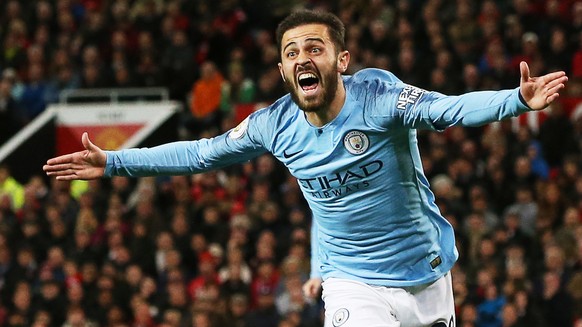 epa07525997 Manchester City&#039;s Bernardo Silva celebrates after scoring the 1-0 lead during the English Premier League soccer match between Manchester United and Manchester City at Old Trafford in  ...