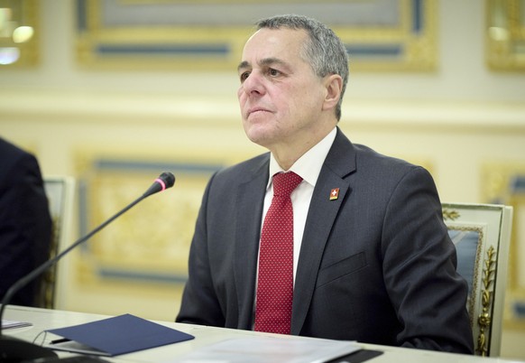 epa12701014 A handout photo made available by the Presidential Press Service shows Swiss Federal Councilor and Chairperson-in-Office of the Organization for Security and Co-operation in Europe (OSCE)  ...