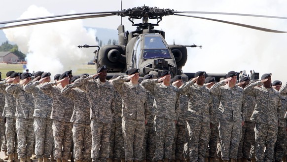 FILE - In this Friday, May 13, 2011 file photo, Soldiers of 1AD attend a color casing ceremony of the First Armored Division at the US Army Airfield in Wiesbaden, Germany. The governors of the four Ge ...