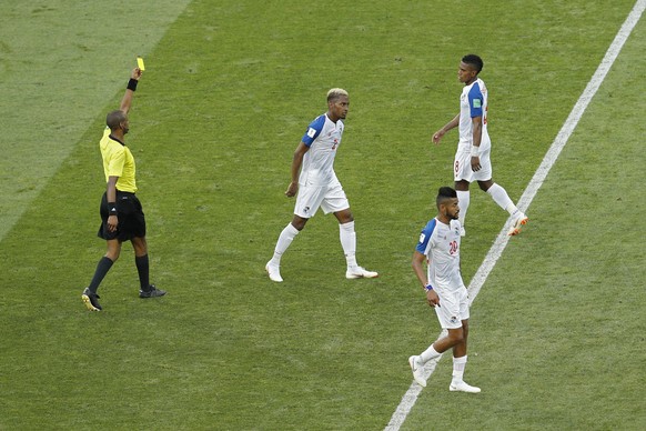 Panama&#039;s Edgar Barcenas, top right, is shown a yellow card by referee Janny Sikazwe, left, from Zambia during the group G match between Belgium and Panama at the 2018 soccer World Cup in the Fish ...