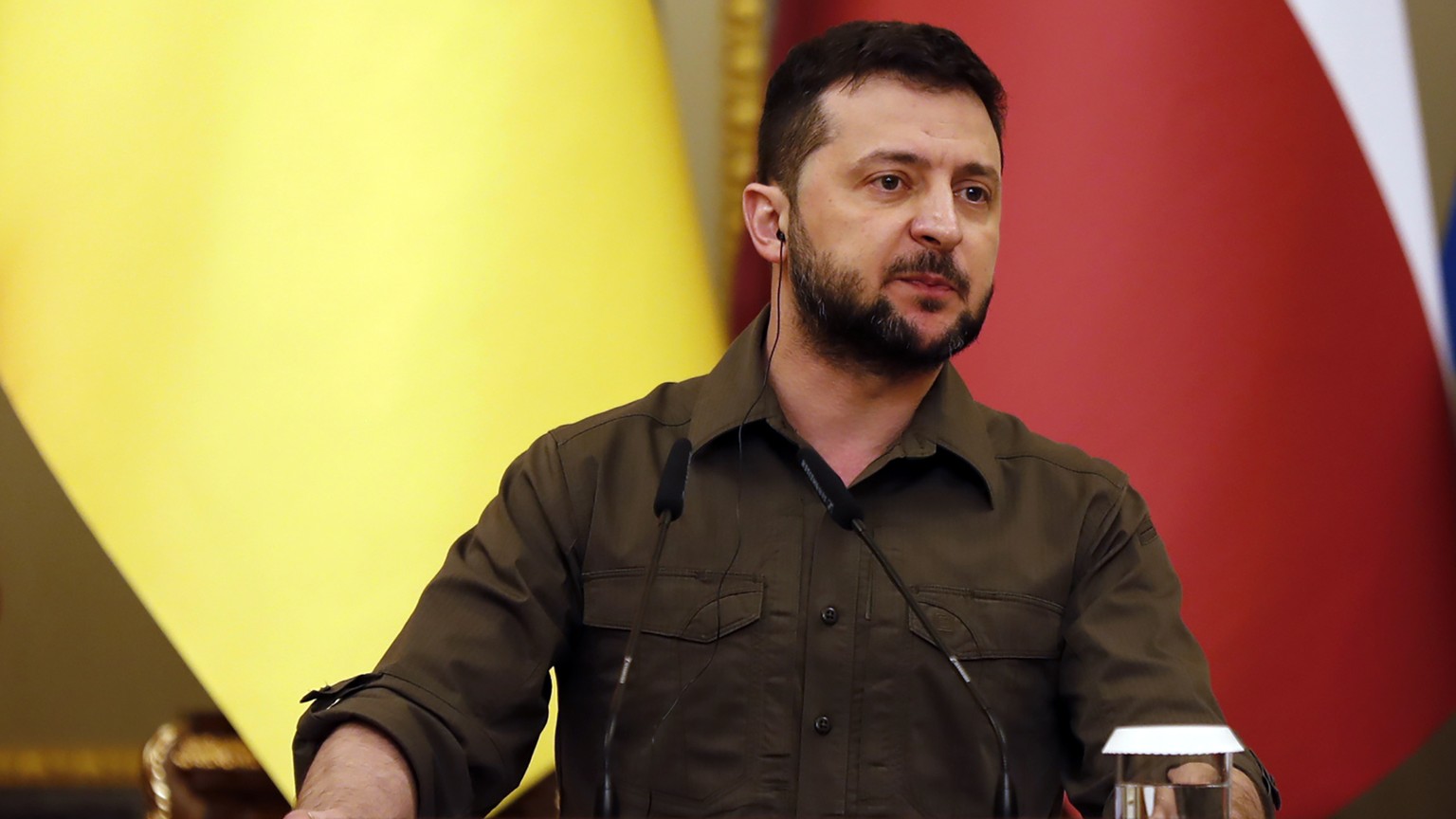 Ukrainian President Volodymyr Zelenskyy speaks alongside the presidents of Poland, Lithuania, Latvia and Estonia during a press conference in Kyiv, Ukraine on Wednesday, April 13, 2022. (AP Photo/Adam ...