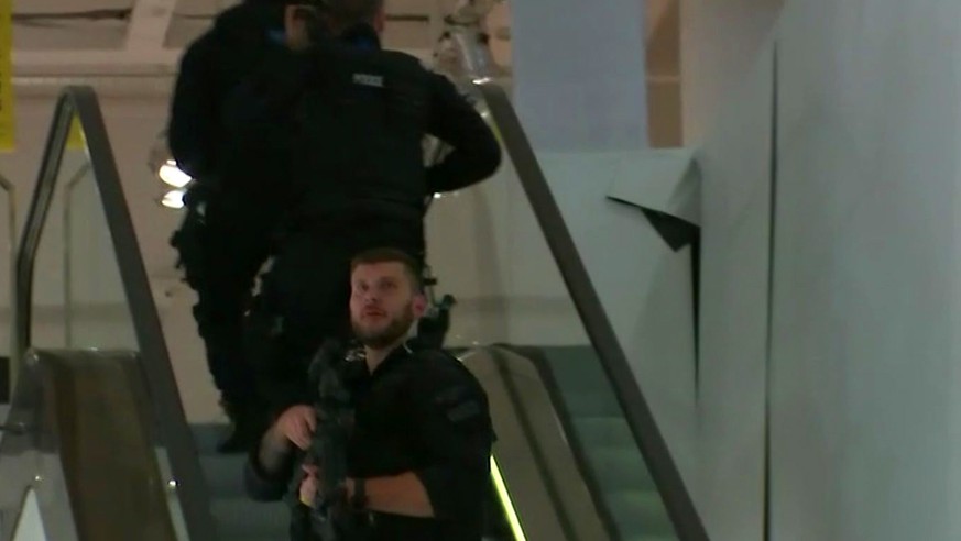 In this grab taken from video, armed police patrol a department store, near to Oxford Street, in London, Friday, Nov. 24, 2017. British police said Friday they were responding to reports of an inciden ...