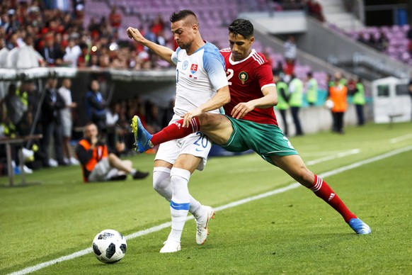 epa06785387 Morocco&#039;s defender Achraf Hakimi (R) in action against Slovakia&#039;s midfielder Robert Mak (L) during the International Friendly soccer match between Morocco and Slovakia at the Sta ...