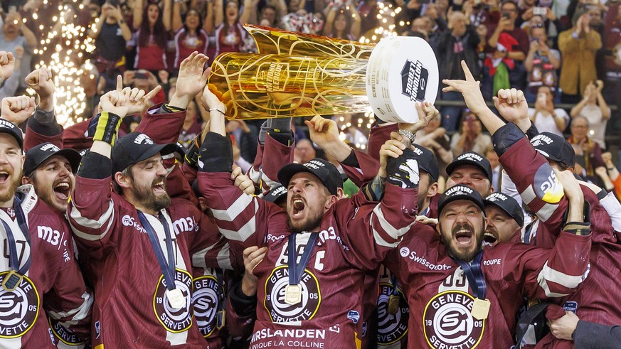 Geneve-Servette&#039;s forward Noah Rod lift the trophy after winning against Biel, during the seventh and final leg of the ice hockey National League Swiss Championship final playoff game between Gen ...