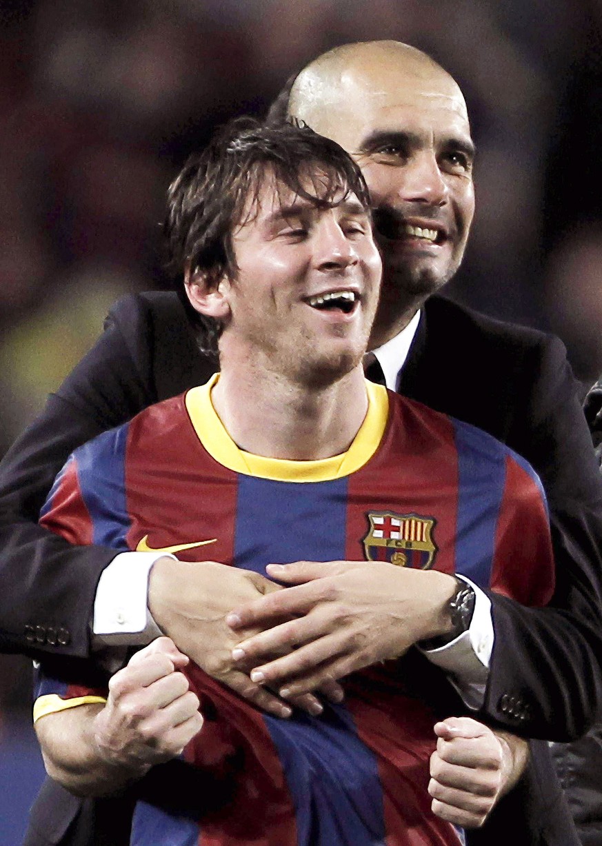 epa08629211 (FILE) A file picture dated 03 May 2011 shows FC Barcelona's head coach Josep Guardiola embracing Argentinian striker Lionel Messi (front) after the UEFA Champions League semi final second ...