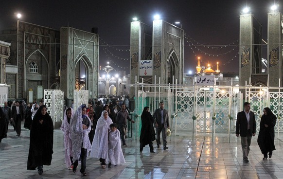 epa08296075 (FILE) - Iranians leave the shrine of Imam Reza in the city of Mashhad, eastern Iran, 12 October 2011 (reissued 15 March 2020). According to reports, Iranian authorities announced the clos ...