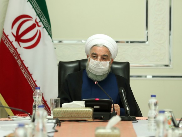 HANDOUT - Präsident Hassan Ruhani während einer Sitzung des Nationalen Komitees zur Bekämpfung des Coronavirus. Foto: -/Iranian Presidency/dpa - ATTENTION: editorial use only and only if the credit me ...