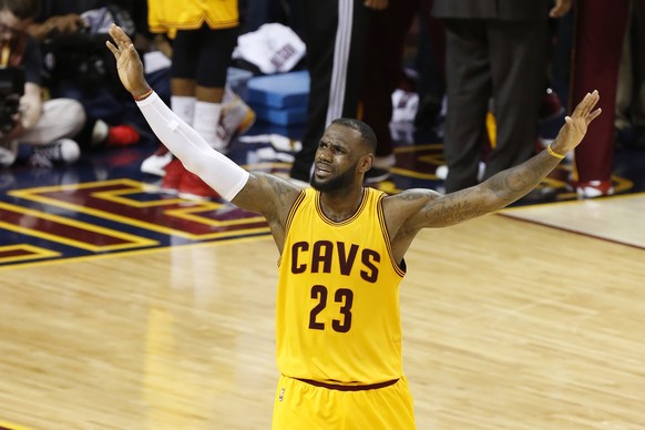 Cleveland Cavaliers forward LeBron James (23) urges on the crowd during the second half of Game 3 of basketball&#039;s NBA Finals against the Golden State Warriors in Cleveland, Tuesday, June 9, 2015. ...