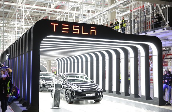 epaselect epa09842006 Tesla vehicles are on display during the opening day of the Tesla &#039;Gigafactory&#039; in Gruenheide near Berlin, Germany, 22 March 2022. German Chancellor Olaf Scholz is also ...