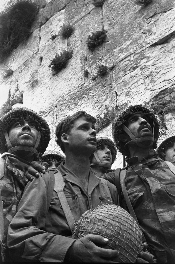 In this photo released by the Government Press Office on Friday June 1, 2007, Israeli army paratroopers Zion Karasanti, left, Yitzhak Yifat, center, and Haim Oshri, right, stand next to the Western Wa ...