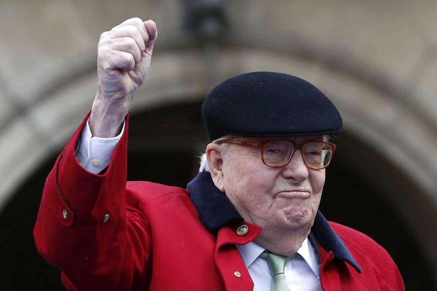 Former far-right National Front party leader Jean-Marie Le Pen clenches his fist at the statue of Joan of Arc, Monday May 1, 2017, in Paris. Jean-Marie Le Pen is holding the Joan of Arc event again Mo ...