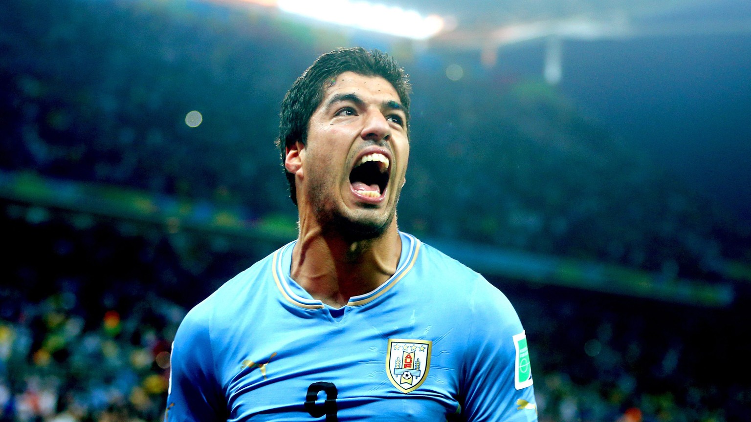 epa04353250 (FILE) A file picture dated 19 June 2014 of Uruguayan striker Luis Suarez celebrating after scoring the 2-1 lead during the FIFA World Cup 2014 group D preliminary round match between Urug ...