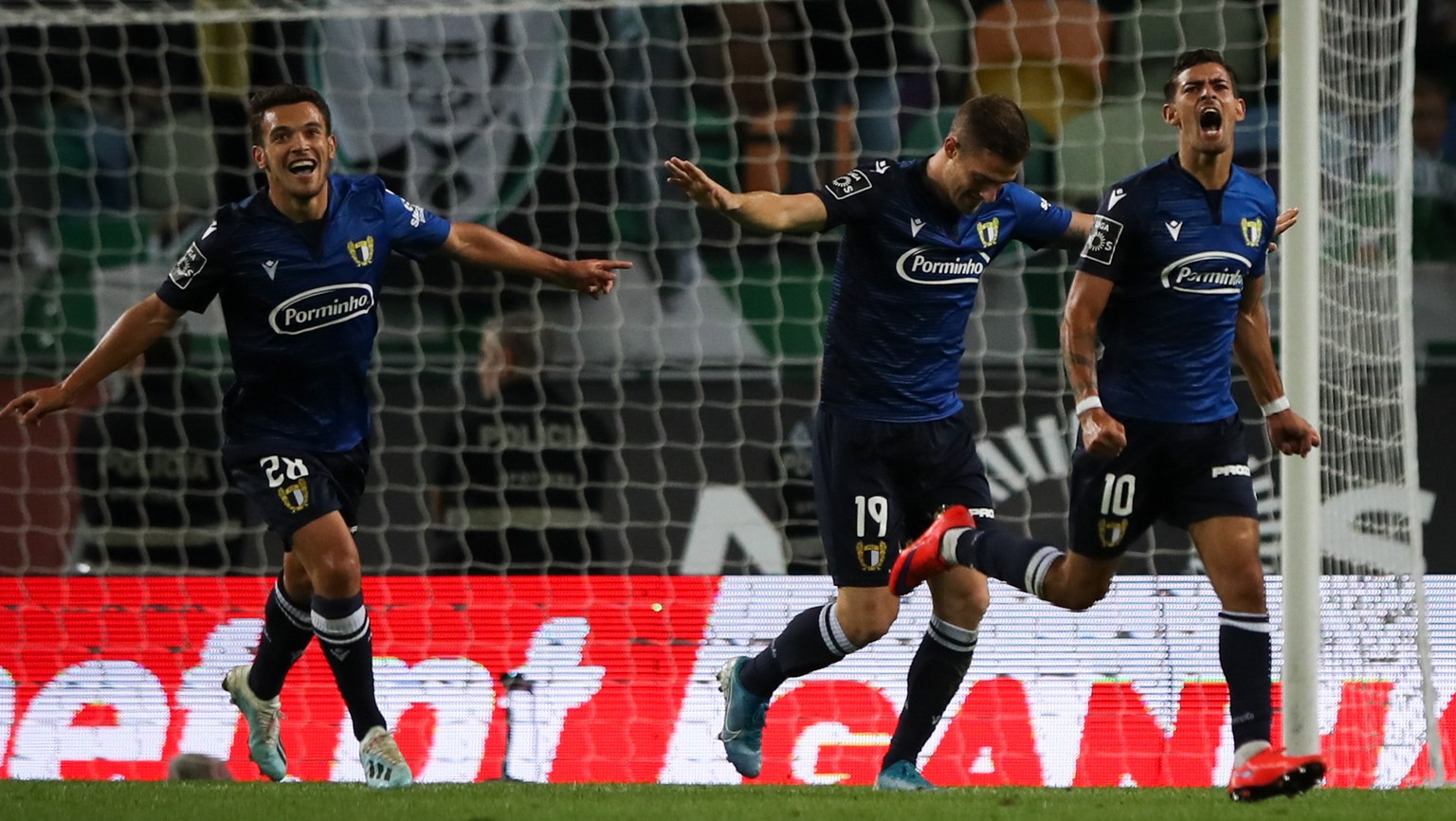 epa07864883 Famalicao&#039;s Ruben Lameiras (R) celebrates after scoring a goal against Sporting during their Portuguese First League soccer match held at Alvalade stadium in Lisbon, Portugal, 23 Sept ...