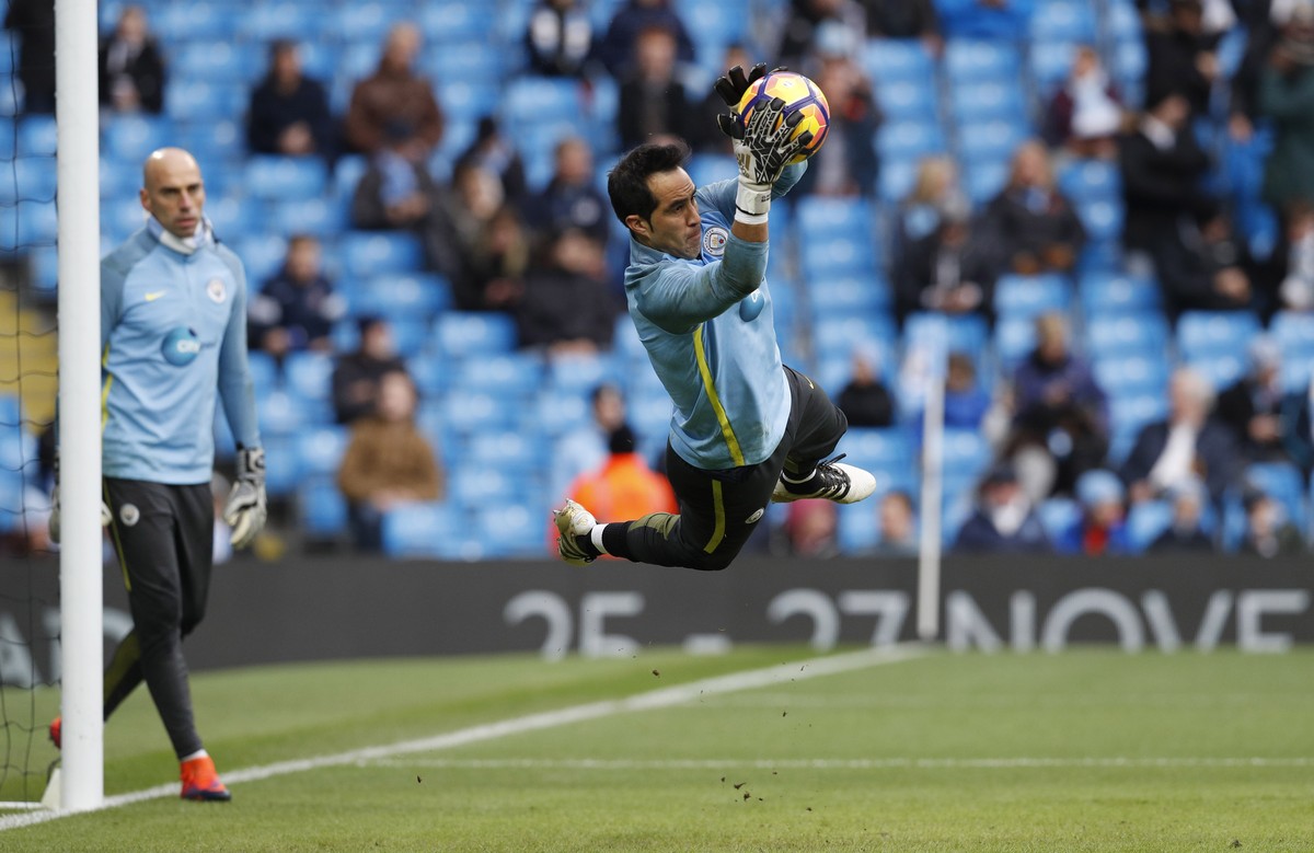 Britain Football Soccer - Manchester City v Middlesbrough - Premier League - Etihad Stadium - 5/11/16 Manchester City's Claudio Bravo warms up before the match as Manchester City's Willy Cab ...