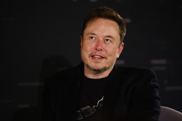 epa10955249 US tech entrepreneur Elon Musk reacts as he attends a conversation event with British Prime Minister Rishi Sunak (unseen) in central London, Britain, 02 November 2023. The conversation wil ...
