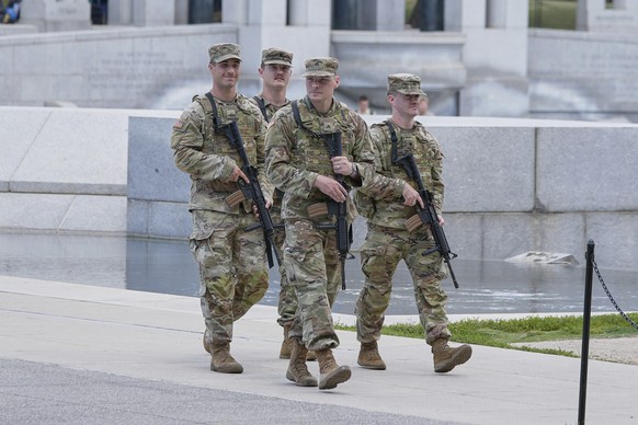 Members of the West Virginia National Guard patrol at the World War II memorial on the National Mall in Washington, Wednesday, Aug. 27, 2025. (AP Photo/Mariam Zuhaib)
Trump District of Columbia