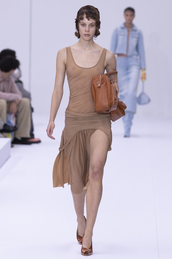 epa11624923 A model presents a creation from the Womenswear Spring/Summer 2025 collection of Acne Studios during the Paris Fashion Week, in Paris, France, 25 September 2024. The presentation of the Wo ...