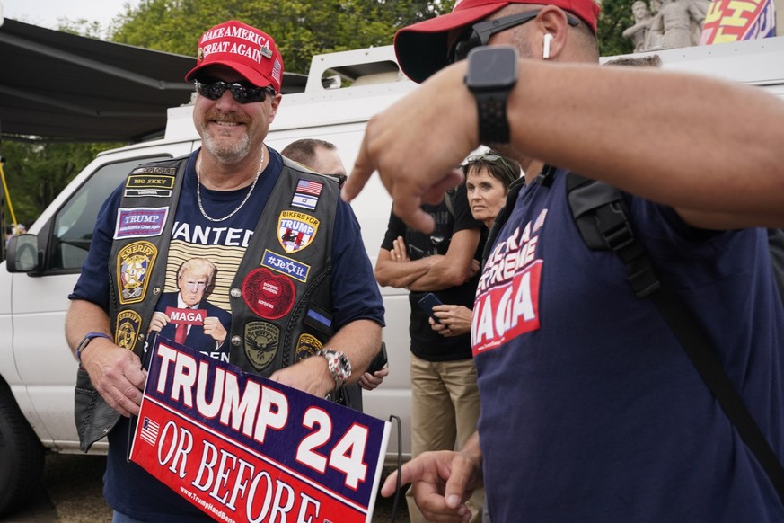 Supporters of Former President Donald Trump gather near the E. Barrett Prettyman U.S. Federal Courthouse, Thursday, Aug. 3, 2023, in Washington. Former President Donald Trump is due in federal court i ...