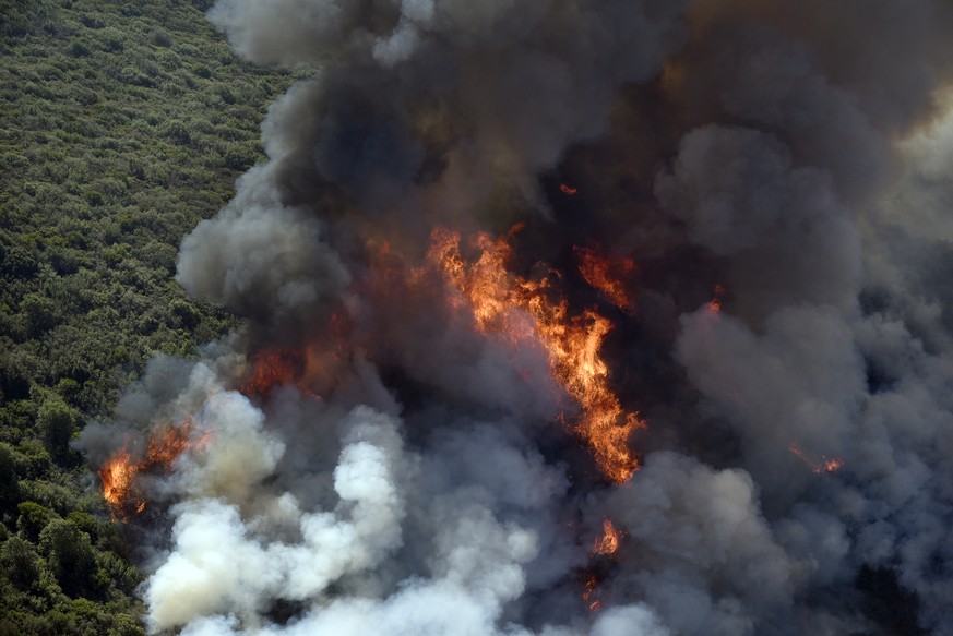 Smoke rises as a wildfire burns in the hills east of Napa, Calif., Monday, Oct. 9, 2017. Wildfires whipped by powerful winds swept through Northern California sending residents on a headlong flight to ...