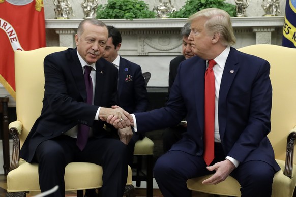 President Donald Trump shakes hands with Turkish President Recep Tayyip Erdogan in the Oval Office of the White House, Wednesday, Nov. 13, 2019, in Washington. (AP Photo/ Evan Vucci)
Donald Trump,Rece ...