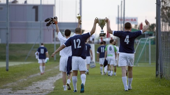 The amateur football players from the team UBS and winners of a regional soccer championship, are about to watch together the EURO 2008 European Soccer Championships match between Russia and Spain, in ...