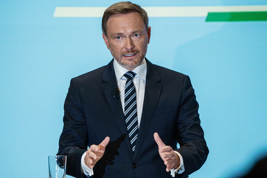 epa09600976 Free Democratic Party (FDP) chairman and faction chairman in the German parliament Bundestag Christian Lindner gestures during the presentation of the coalition contract in Berlin, Germany ...