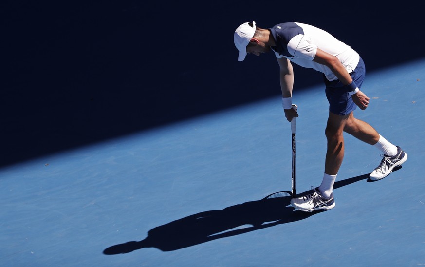 Serbia&#039;s Novak Djokovic casts the shadow on the Rod Laver Arena as he plays France&#039;s Gael Monfils during their second round match at the Australian Open tennis championships in Melbourne, Au ...