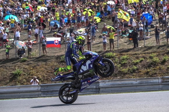 epa06926915 Italian MotoGP rider Valentino Rossi of Movistar Yamaha MotoGP does a wheelie after the qualification of the Motorcycling Grand Prix of the Czech Republic at Masaryk circuit in Brno, Czech ...