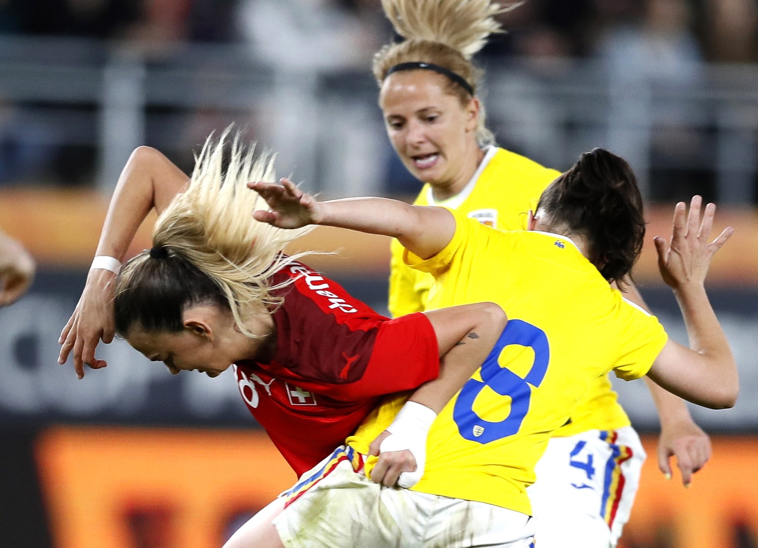 epa09878857 Riola Xhemaili (L) of Switzerland in action against Stefania Vatafu (R) of Romania during the FIFA Women&#039;s World Cup qualifying soccer match between Romania and Switzerland in Buchare ...