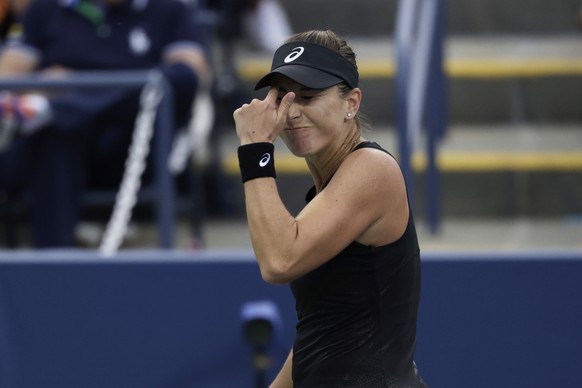 Belinda Bencic, of Switzerland, reacts during a match against Zhang Shuai, of China, in the first-round of the U.S. Open tennis championships, Sunday, Aug. 24, 2025, in New York. (AP Photo/Adam Hunger ...