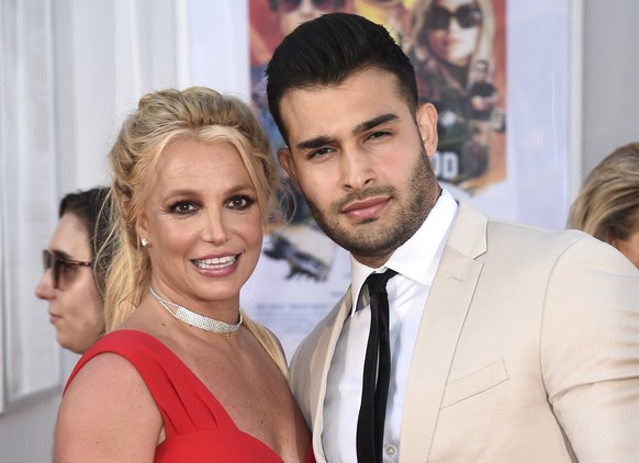 FILE - Britney Spears and Sam Asghari appear at the Los Angeles premiere of &quot;Once Upon a Time in Hollywood&quot; on July 22, 2019. Asghari has filed for divorce from Spears, a person familiar wit ...