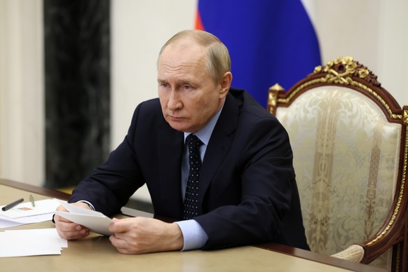 epa10294287 Russian President Vladimir Putin chairs a meeting to discuss income support for families with children, via a video conference at the Kremlin in Moscow, Russia, 08 November 2022. EPA/MIKHA ...
