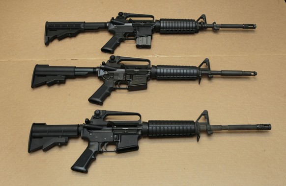 FILE -Three variations of the AR-15 assault rifle are displayed at the California Department of Justice in Sacramento, Calif., on Aug. 15, 2012. In acknowledgment of Gun Violence Awareness Day, Gov. G ...