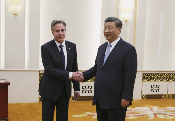 U.S. Secretary of State Antony Blinken shakes hands with Chinese President Xi Jinping in the Great Hall of the People in Beijing, China, Monday, June 19, 2023. (Leah Millis/Pool Photo via AP)