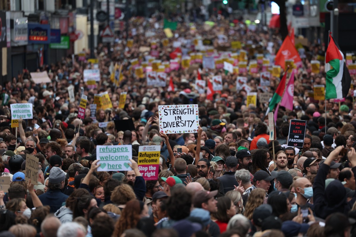 epa11534645 Anti-racist protesters gather in Walthamstow, east London, Britain, 07 August 2024. Further far-right protests are expected on 07 August 2024. Violent demonstrations have been held by memb ...
