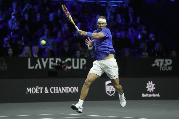 Team Europe's Rafael Nadal playing with Roger Federer makes a return during their Laver Cup doubles match against Team World's Jack Sock and Frances Tiafoe at the O2 arena in London, Friday, Sept. 23, 2022. (AP Photo/Kin Cheung)