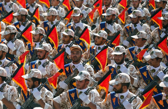 epa04411795 Iranian Revolutionary Guards march during the annual military parade marking the Iraqi invasion in 1980, which led to a eight-year-long war (1980-1988) in Tehran, Iran, 22 September 2014.  ...