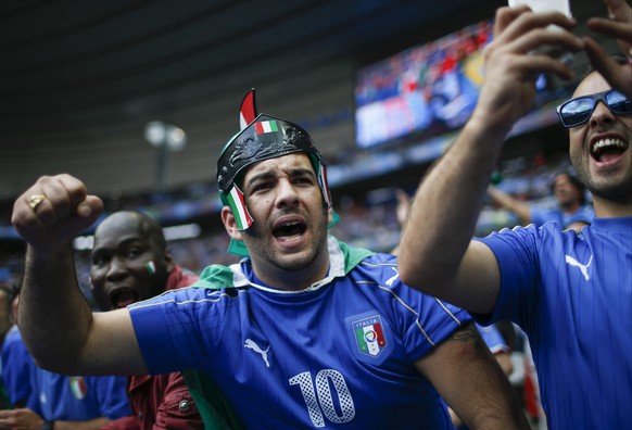 Italy supporters cheer on the stands before the Euro 2016 round of 16 soccer match between Italy and Spain, at the Stade de France, in Saint-Denis, north of Paris, Monday, June 27, 2016. (AP Photo/Man ...