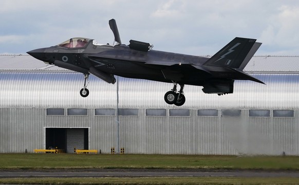 FILE - A Royal Air Force F-35 lands at the Farnborough International Air Show in Farnborough, England, on July 22, 2024. (AP Photo/Alberto Pezzali, File)