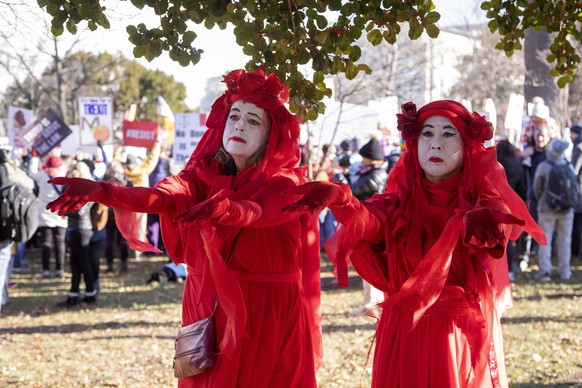 epa08079526 Activists gather at a &#039;Impeach and Remove&#039; rally to show support for the Congressional impeachment of US President Donald J. Trump outside the US Capitol in Washington, DC, USA,  ...