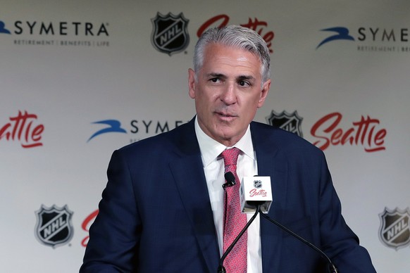 FILE - In this July 18, 2019, file photo, Ron Francis talks to reporters in Seattle, after he was introduced as the first general manager for Seattle&#039;s yet-to-be-named NHL expansion team. Scouts  ...