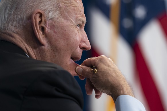 President Joe Biden listens during a virtual meeting with FEMA Administrator Deanne Criswell and governors and mayors of areas impacted by Hurricane Ida, in the South Court Auditorium on the White Hou ...