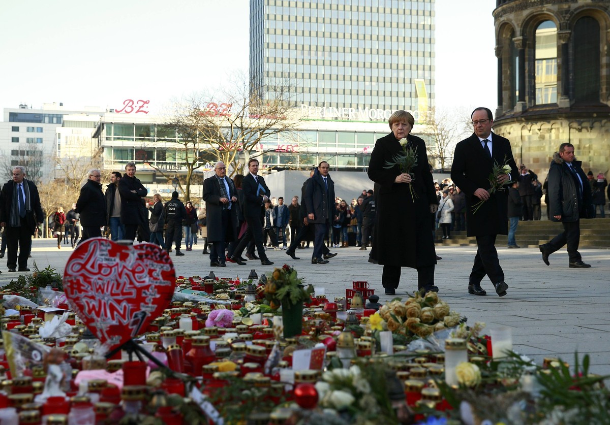 German Chancellor Angela Merkel and French President Francois Hollande visit the site where on December 19, 2016 a truck ploughed through a crowd at a Christmas market on Breitscheidplatz square in Be ...