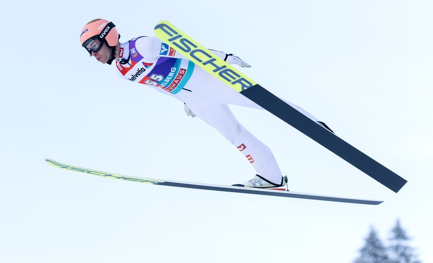 Stefan Kraft of Austria soars through the air during the men&#039;s FIS Ski Jumping World Cup competition at the Gross-Titlis Schanze on Sunday, December 18, 2022 in Engelberg, Switzerland. (KEYSTONE/ ...