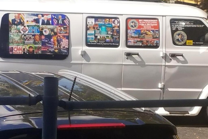 This Nov. 1, 2017, photo shows a van with windows covered with an assortment of stickers in Well, Fla. Federal authorities took Cesar Sayoc into custody on Friday, Oct. 26, 2018, and confiscated his v ...
