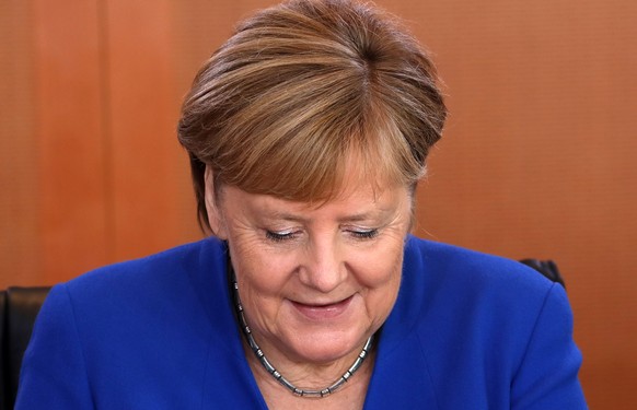 epa07942288 German Chancellor Angela Merkel attends the weekly meeting of the German Federal cabinet at the Chancellery in Berlin, Germany, 23 October 2019. During the 72st cabinet meeting, the minist ...