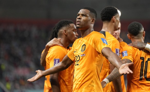 Denzel Dumfries of the Netherlands celebrates scoring his side&#039;s 3rd goal during the World Cup round of 16 soccer match between the Netherlands and the United States, at the Khalifa International ...