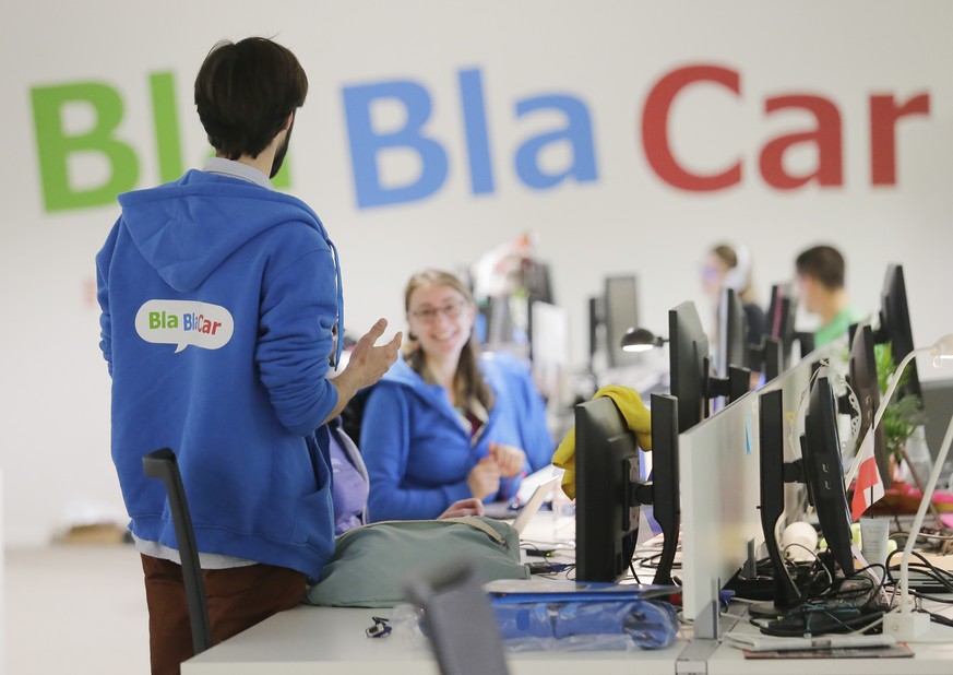 FILE - In this April 17, 2015 file photo, employees works at BlaBlaCar in Paris, France. French startup Blablacar, which hooks up travelers who want to share a car for long-distance trips, says Thursd ...
