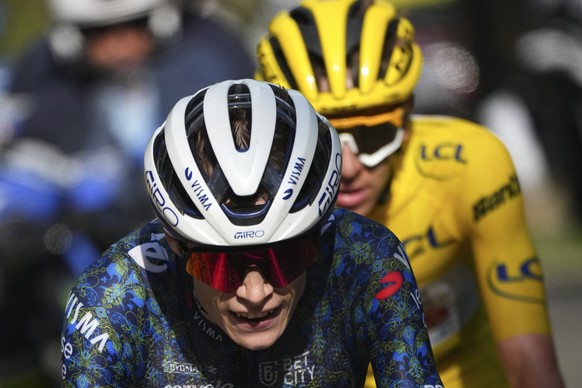Denmark&#039;s Jonas Vingegaard is followed by Slovenia&#039;s Tadej Pogacar, wearing the overall leader&#039;s yellow jersey, during the twentieth stage of the Tour de France cycling race over 132.8  ...